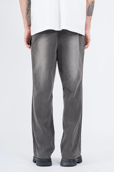 RELAXED DENIM FLARED PANTS IN PIGMENT WASHED