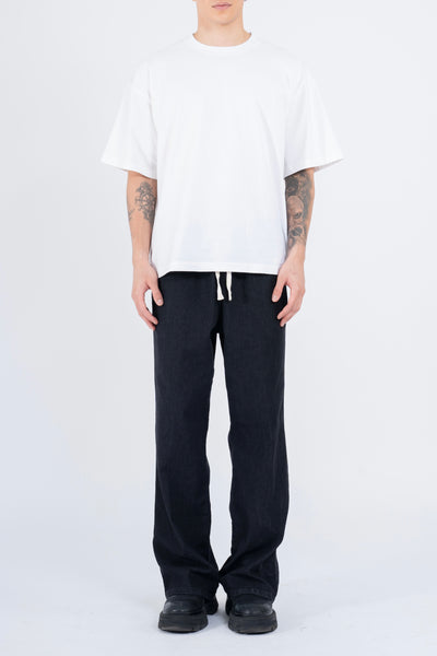 RELAXED DENIM FLARED PANTS IN STONE WASHED