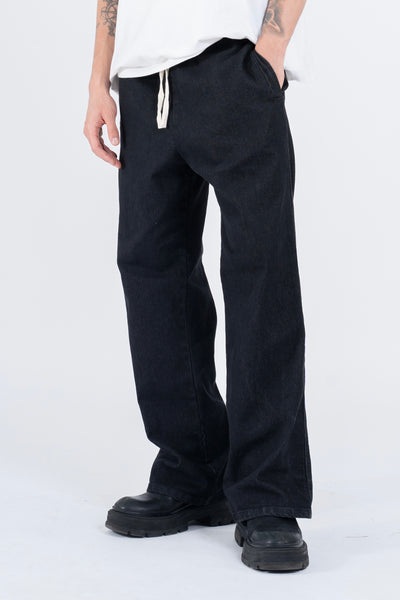 RELAXED DENIM FLARED PANTS IN STONE WASHED