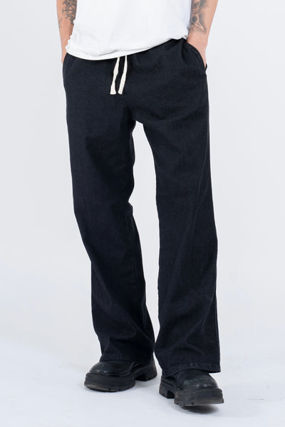 RELAXED DENIM FLARED PANTS IN STONE WASHED