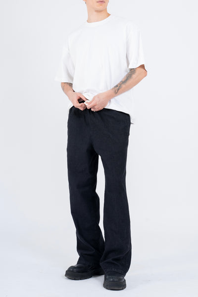 RELAXED DENIM FLARED PANTS IN STONE WASHED