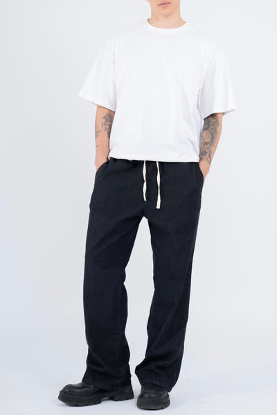 RELAXED DENIM FLARED PANTS IN STONE WASHED